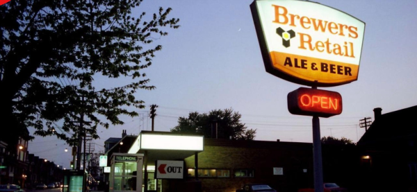 Brewers Retail sign at night, Gerrard Street East and Logan Avenue in Toronto, 1982. (City of Toronto Archives, Fonds 620, Item 636.)