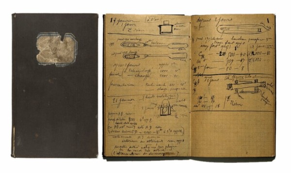 An old notebook with notes and diagrams written in Marie Curie's hand. 